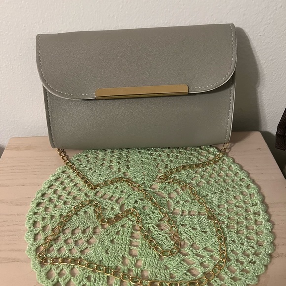 Non Brand Gray Crossbody, never used, smoke free home. Comes with a dust bag. - Picture 6 of 6